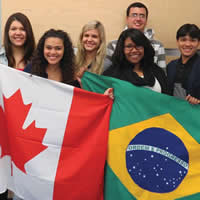 Group of students from the College of the Rockies holding the Canadian and Brazilian flags