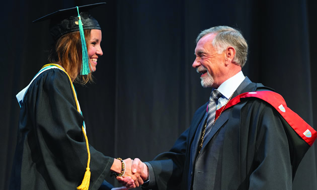 College of the Rockies President and CEO, David Walls, congratulates Lieutenant Governor’s Medal recipient, Brenda Cortes Vargas, at the 43rd annual commencement ceremony on Friday, June 7.