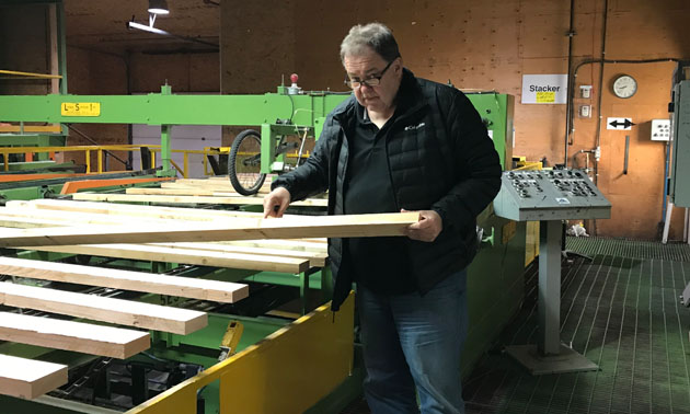 Brian Fehr points out the joints on a 2x4 at his Peak Industries plant off Theatre Road in Cranbrook and says this product is selling well.
