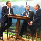 Three men conducting a presentation