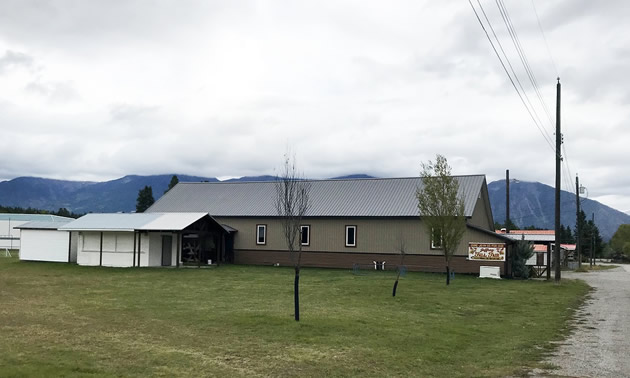 Building in field. 