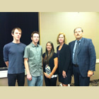 Photo of COTR scholarship winners Nicholas Johnson, Danielle Elliott and Daniel Marti shown with publisher Keith Powell.