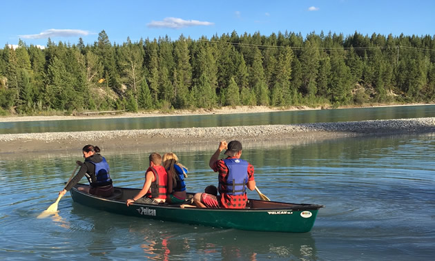 Guests of The Flats RV & Campground launch their canoe onto the adjacent Kootenay River