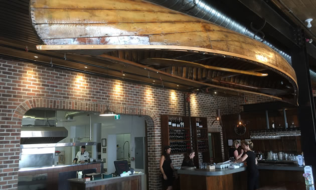 Warmly-hued brick, reclaimed lumber and an original art-deco front entrance greet the visitor to this fully refurbished building in Creston. 