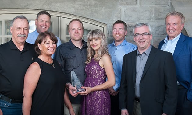 Chasse Holding’s Jacques and Shelly Chasse plus Brady and Krystle Chasse receive their prestigious award from Canfor management. 