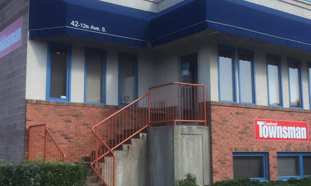 Location of Cranbrook Townsman - office building with steps leading up to front door. 