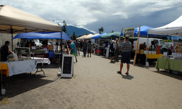 A row of stalls at the Creston Valley Farmers' market.