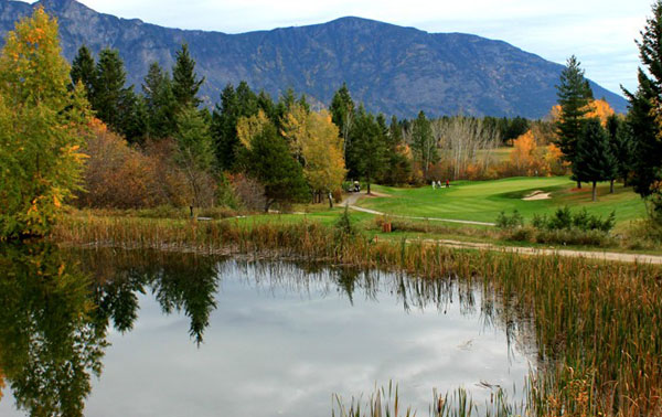 Autumn is a beautiful time of year to enjoy a round of golf at the Creston Golf Club. Pond in foreground, fall trees in background. 