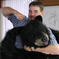 Curtis Helgesen, chief administrative officer for Elkford, B.C., demonstrates the community's brand, 