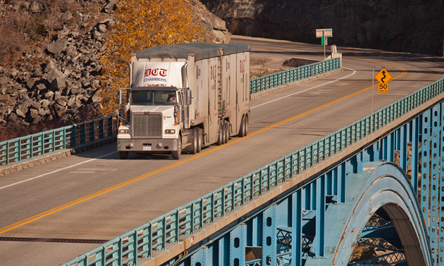 DCT Chambers truck on an elevated stretch of highway built on a mountainside