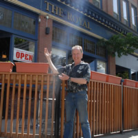 Dale Arsenault standing in front of The Royal restaurant in Nelson, BC