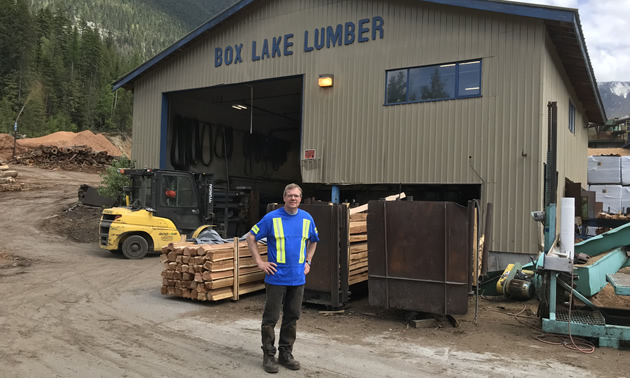 Dan Wiebe stands outside his split-rail cedar fencing plant