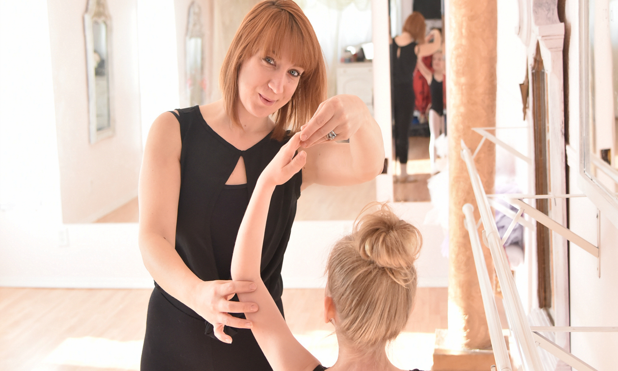 Danielle Labelle helping a young girl learn to dance