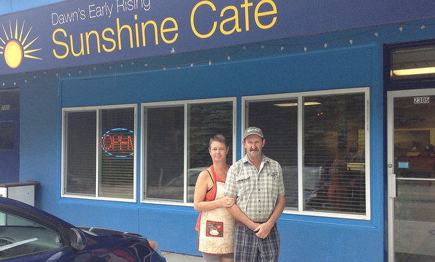 Tom and Kathy Frauley, owners and cooks at Dawn's Early Rising Cafe in Castlegar, stand outside their restaurant.