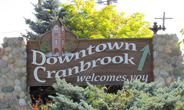 Stone and wood make up the Downtown Cranbrook sign that welcomes visitors