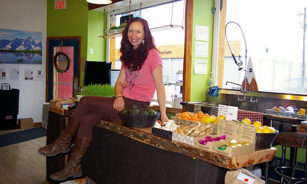 Nicole Du Vent sits on her countertop in her new health food store, Eat Pure Mountain Market, in Golden.