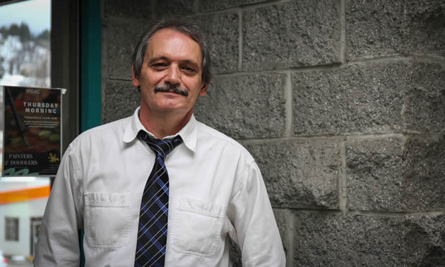 Ed Attridge, the new executive director of the Trail & District Chamber of Commerce, stands at the chamber entrance