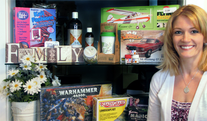 woman standing beside a shelf full of hobby items