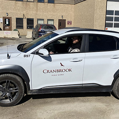 Evan Berry, energy conservationist for the City of Cranbrook, takes a ride in the City’s first electric vehicle.