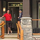 Two men chat at the entrance to the Elk Park showhome