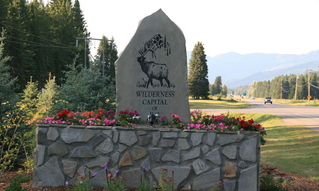 Welcome to Elkford sign, with flower beds. 