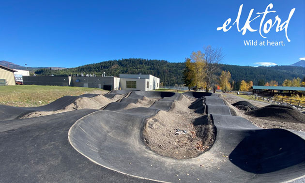 Photo of Elkford bike park, with District of Elkford logo in upper right-hand corner of picture. 