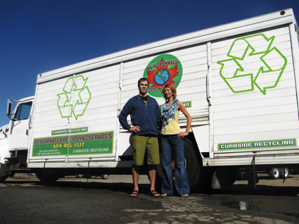 Lance Schultz and Angela Poole stand in front of their recycling truck. 