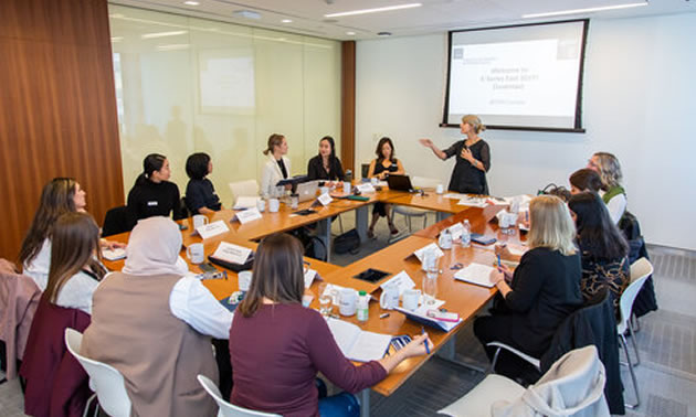 Group of women attending conference. 