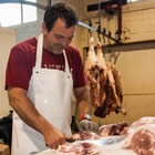 Photo of Thomas Fritz standing by a meat counter in Creston BC