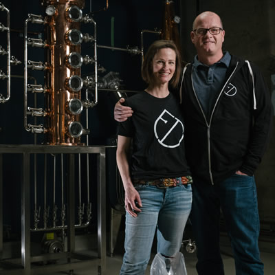 Jillian Rutherford and Andrew Hayden stand at the heart of their new business, Fernie Distillers in Fernie, B.C.