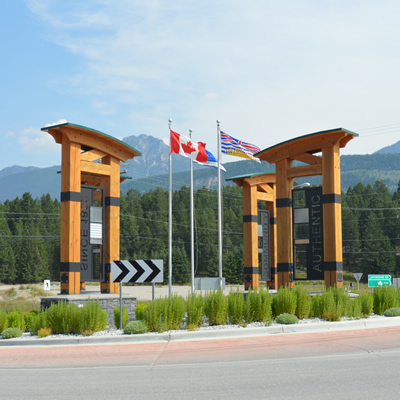 Flags and timber archways form a distinctive landmark at the entrance to Golden, B.C.