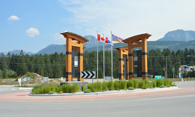 Flags and timber archways form a distinctive landmark at the entrance to Golden, B.C.