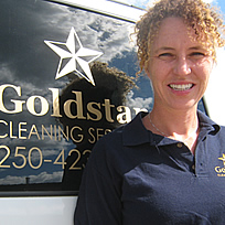 Jill Barclay standing beside the Goldstar van