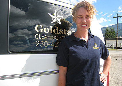 Jill Barclay standing beside the Goldstar van
