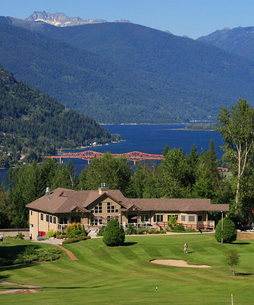 Clubhouse at Granite Point Golf Course, Nelson bridge and lake in background. 
