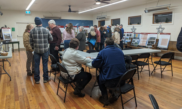 Community members discuss Koocanusa recreation at the Grasmere open house.