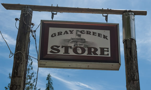 A sign reads Gray Creek Store and has a picture of a sternwheeler.