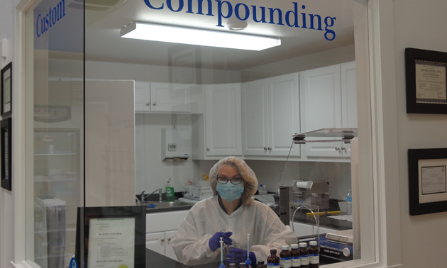 a woman in the compounding lab at Gray’s Compounding Pharmacy Remedy’s RX 