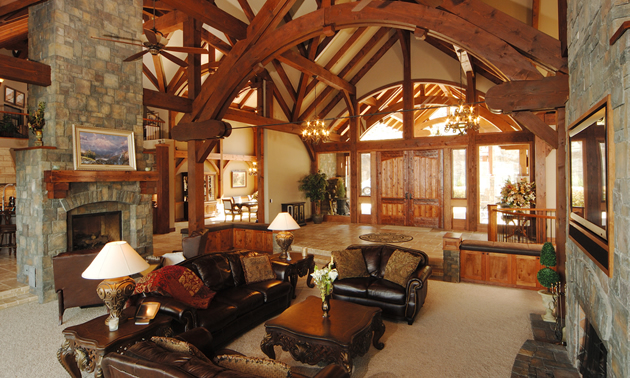 Great room with natural light, exposed timbers and leather furniture