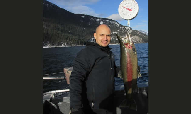 Photo of Hector Sandoval of Creston with his winning Rainbow Trout