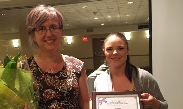 Cutline:
Rachel Ross (L), vice-president of Mandala Homes in Nelson, was a winner in the 2015 Influential Women in Business Awards, West Kootenay division, sponsored by Kootenay Business magazine. The magazine's sales rep, Kyla MacNeil, was happy to present the award.