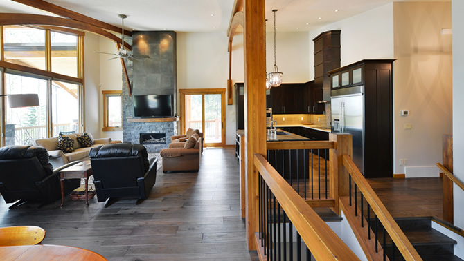 The interior of an energy-efficient home built by Tyee Custom Homes in Kimberley, B.C., showing the long view to the fireplace.