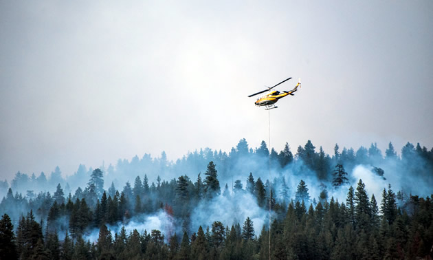 Helicopters fighting forest fires in Kootenays, B.C. in August, 2018.