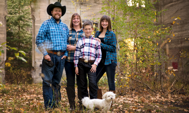 (L to R) Ryan Doehle, wife Laurel, son Ethan, and daughter Kyra with their dog WiFi. 