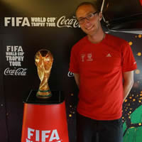 Joel Robison, photographer, with the FIFA World Cup trophy