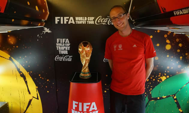 Joel Robison, photographer, with the Fifa World Cup trophy