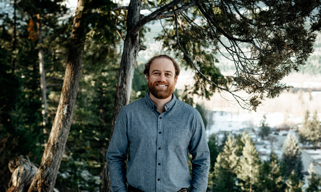 Jason Jones of LARCH Landscape Architecture + Authentic Mountain Design in Golden, B.C., and a background of trees.