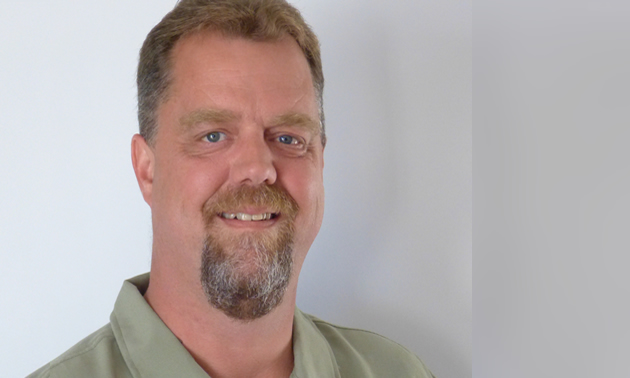 smiling man with trim goatee