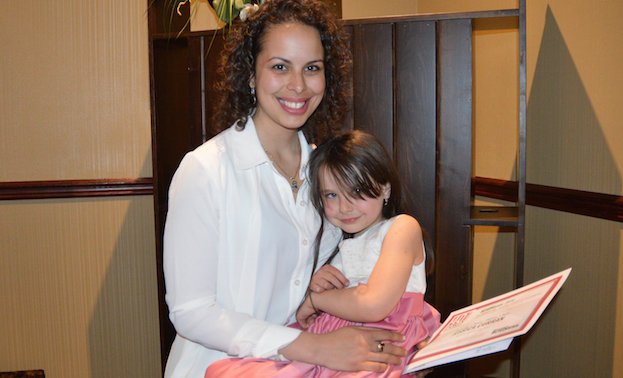 Jessica Curran, owner of Primary Choice Homes Corp., in Nelson, B.C., is posing with her daughter Cai. 