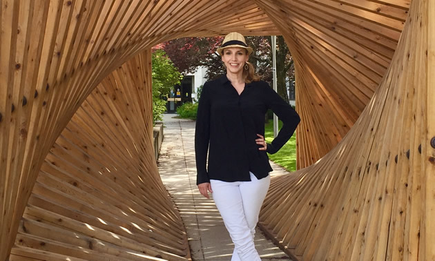 Joy Barrett, cultural development officer for Nelson, B.C., and executive director of Castlegar Sculpturewalk, stands within “Sculpture Walk” by Spring Shine, Christopher Petersen and Hans Winter (2016).